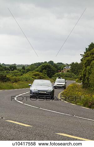 Cars on the road, Ring Of Kerry, County Kerry, Republic of Ireland View Large Photo Image Stock Photo - Cars on the road, Ring Of Kerry, County Kerry, Republic of Ireland. Fotosearch