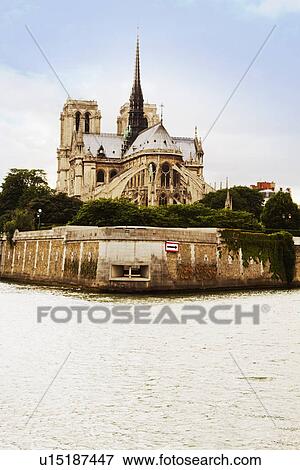 Stock Photo - Cathedral at the riverside, Notre Dame de Paris, Seine River, Paris, France. Fotosearch