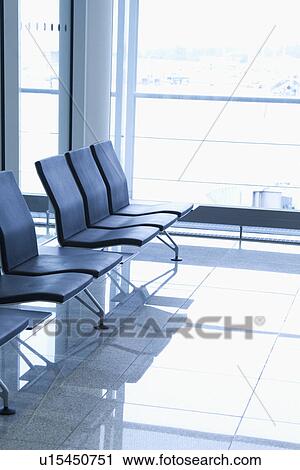 Stock Image - Chairs at an airport lounge, Paris, France. Fotosearch