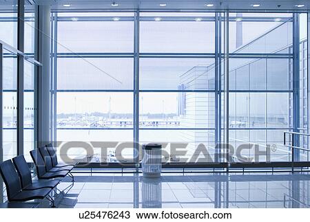 Stock Image - Chairs at an airport lounge, Paris, France. Fotosearch