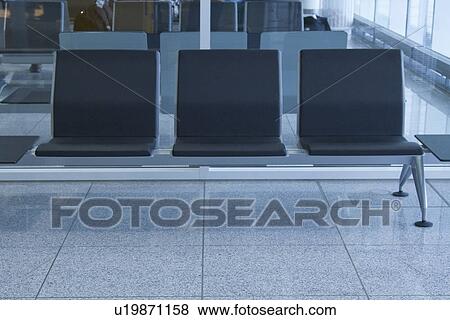 Stock Photo - Chairs at an airport lounge, Paris, France. Fotosearch