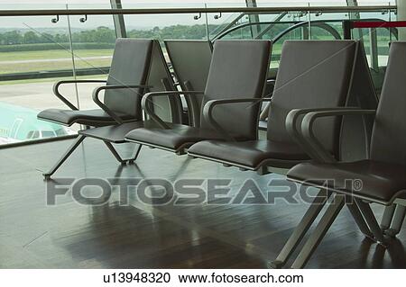 Stock Image - Chairs in an airport lounge, Cork Airport, Cork, County Cork, Republic of Ireland. Fotosearch