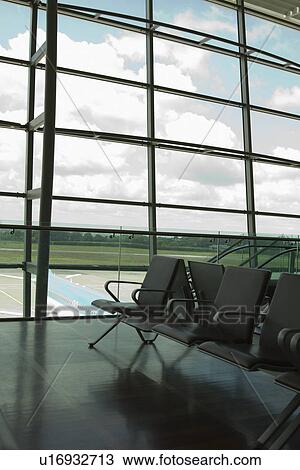 Stock Image - Chairs in an airport lounge, Cork Airport, Cork, County Cork, Republic of Ireland. Fotosearch