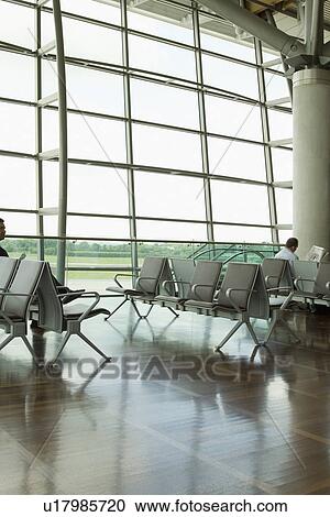 Stock Image - Chairs in an airport lounge, Cork Airport, Cork, County Cork, Republic of Ireland. Fotosearch