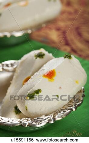 Cham cham a traditional Indian sweet made from chhena (cottage cheese) and khoya (solid milk) View Large Photo Image Stock Photograph - Cham cham a traditional Indian sweet made from chhena (cottage cheese) and khoya (solid milk). Fotosearch
