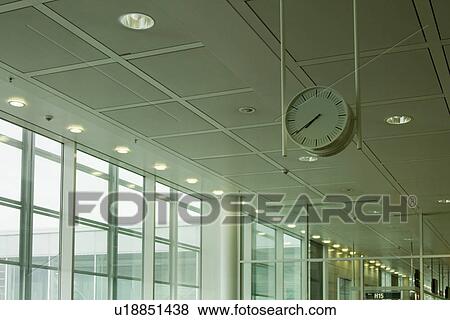 Clock at an airport lounge, Paris, France View Large Photo Image Stock Photo - Clock at an airport lounge, Paris, France. Fotosearch