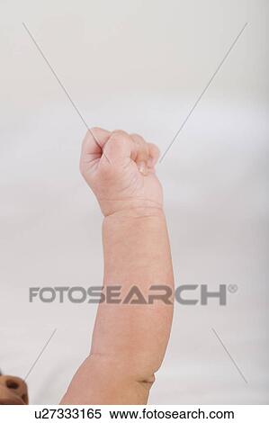 Stock Photography - Close-up of a baby's hand. Fotosearch