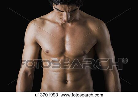 Stock Image - Close-up of a bare chested man. Fotosearch