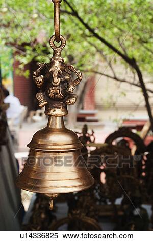 Close-up of a bell hanging at a market stall, New Delhi, India View Large Photo Image Stock Photography - Close-up of a bell hanging at a market stall, New Delhi, India. Fotosearch