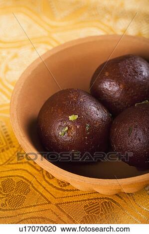 Close-up of a bowl of gulab jamun (a popular traditional Indian sweet) View Large Photo Image Stock Image - Close-up of a bowl of gulab jamun (a popular traditional Indian sweet). Fotosearch