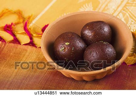 Close-up of a bowls of gulab jamun (a popular traditional Indian sweet) View Large Photo Image Stock Image - Close-up of a bowls of gulab jamun (a popular traditional Indian sweet). Fotosearch