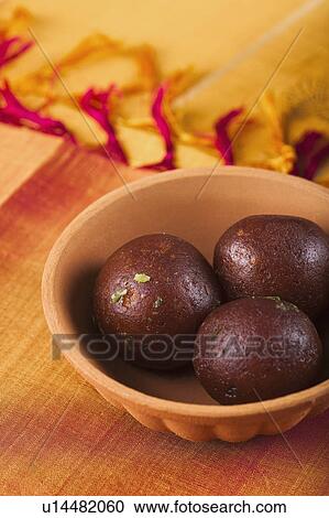 Close-up of a bowls of gulab jamun (a popular traditional Indian sweet) View Large Photo Image Stock Image - Close-up of a bowls of gulab jamun (a popular traditional Indian sweet). Fotosearch