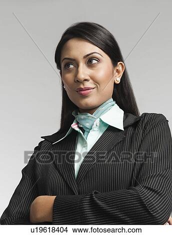 Picture - Close-up of a businesswoman thinking. Fotosearch