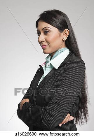 Close-up of a businesswoman with arms crossed View Large Photo Image Stock Image - Close-up of a businesswoman with arms crossed. Fotosearch