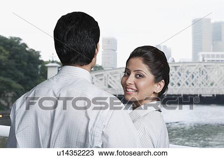 Stock Image - Close-up of a couple in a park. Fotosearch