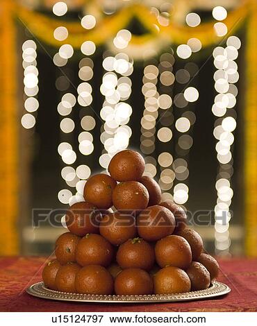 Stock Photo - Close-up of a heap of gulab jamuns (a popular traditional Indian sweet). Fotosearch