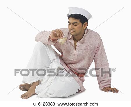 Close-up of a man drinking tea View Large Photo Image Stock Image - Close-up of a man drinking tea. Fotosearch