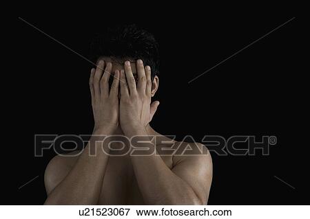 Close-up of a man hiding his face with his hands View Large Photo Image Stock Photo - Close-up of a man hiding his face with his hands. Fotosearch