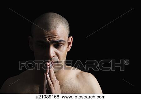 Close-up of a man looking sad View Large Photo Image Stock Photo - Close-up of a man looking sad. Fotosearch