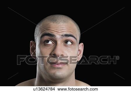 Close-up of a man looking up View Large Photo Image Picture - Close-up of a man looking up. Fotosearch