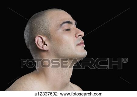 Close-up of a man meditating View Large Photo Image Stock Image - Close-up of a man meditating. Fotosearch