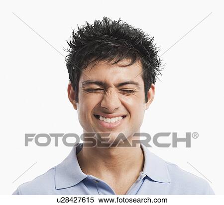 Close-up of a man squinting and smiling View Large Photo Image Stock Photography - Close-up of a man squinting and smiling. Fotosearch