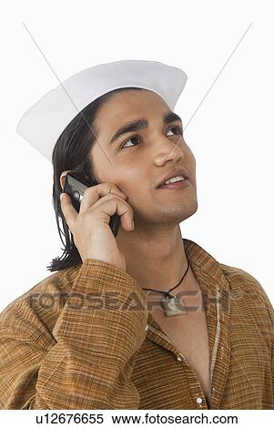 Close-up of a man talking on a mobile phone View Large Photo Image Stock Photography - Close-up of a man talking on a mobile phone. Fotosearch