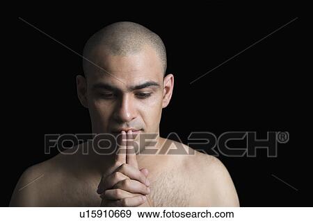 Stock Photo - Close-up of a man thinking. Fotosearch