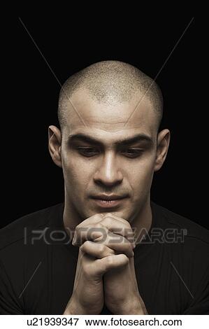 Close-up of a man with clasping hands View Large Photo Image Stock Photo - Close-up of a man with clasping hands. Fotosearch