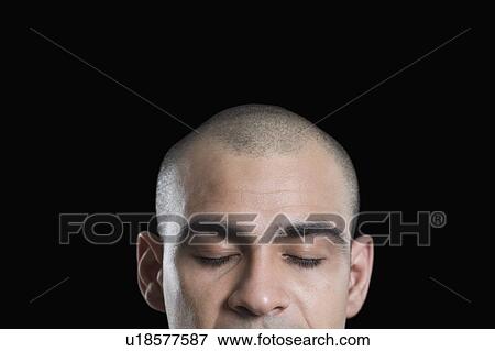 Stock Photo - Close-up of a man with his eyes closed. Fotosearch