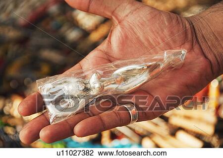 Close-up of a metal figurine on a person's palm, Goa, India View Large Photo Image Stock Image - Close-up of a metal figurine on a person's palm, Goa, India. Fotosearch