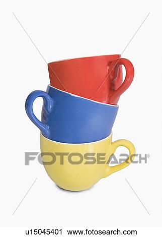 Stock Image - Close-up of a stack of colorful tea cups. Fotosearch