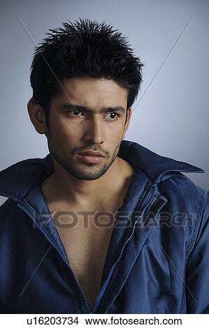 Picture - Close-up of a stylish young man posing. Fotosearch
