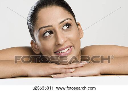 Close-up of a woman day dreaming View Large Photo Image Stock Image - Close-up of a woman day dreaming. Fotosearch