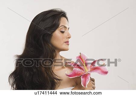 Close-up of a woman holding a Tiger Lily flower View Large Photo Image Picture - Close-up of a woman holding a Tiger Lily flower. Fotosearch