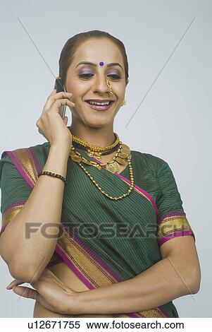 Close-up of a woman talking on a mobile phone View Large Photo Image Stock Photography - Close-up of a woman talking on a mobile phone. Fotosearch