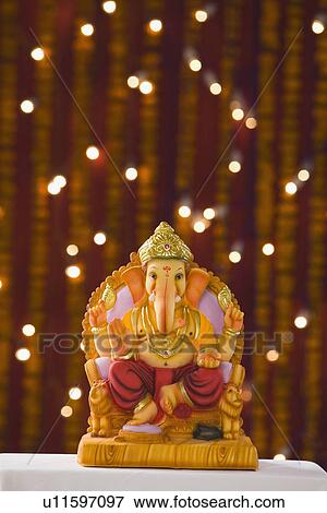 Close-up of an idol of Lord Ganesha View Large Photo Image Stock Photo - Close-up of an idol of Lord Ganesha. Fotosearch