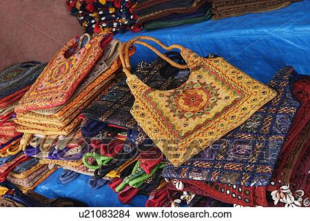 Close-up of bags for sale at a market stall, New Delhi, India View Large Photo Image Picture - Close-up of bags for sale at a market stall, New Delhi, India. Fotosearch