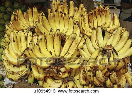 Stock Image - Close-up of bananas on a stall. Fotosearch