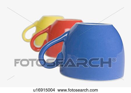 Picture - Close-up of colorful tea cups in a row. Fotosearch