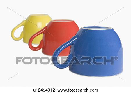 Stock Image - Close-up of colorful tea cups in a row. Fotosearch