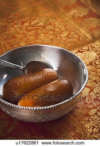 Close-up of gulab jamuns a popular Indian sweet View Large Photo Image Stock Image - Close-up of gulab jamuns a popular Indian sweet. Fotosearch