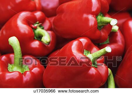 Stock Photograph - Close-up of red bell peppers at a market stall. Fotosearch