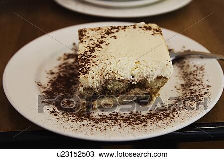Stock Image - Close-up of Tiramisu in a plate. Fotosearch