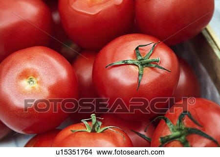 Picture - Close-up of tomatoes at a market stall. Fotosearch
