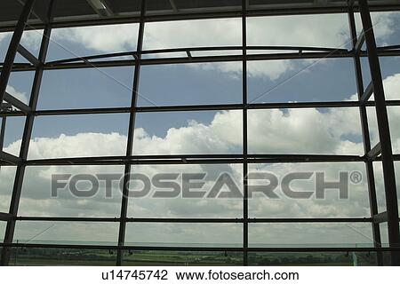 Clouds viewed through an airport lounge window, Cork Airport, Cork, County Cork, Republic of Ireland View Large Photo Image Stock Image - Clouds viewed through an airport lounge window, Cork Airport, Cork, County Cork, Republic of Ireland. Fotosearch