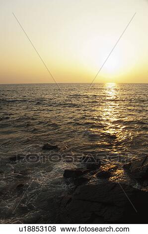 Stock Photo - Coast at sunset, Goa, India. Fotosearch