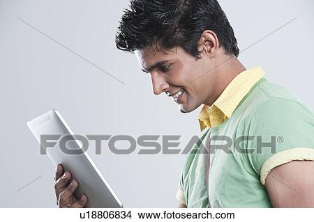 College student using a digital tablet View Large Photo Image Picture - College student using a digital tablet. Fotosearch