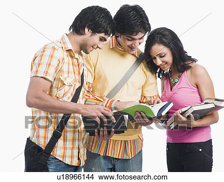 Picture - College students reading books. Fotosearch