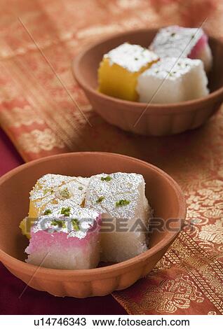 Colorful coconut burfi in bowls View Large Photo Image Stock Image - Colorful coconut burfi in bowls. Fotosearch